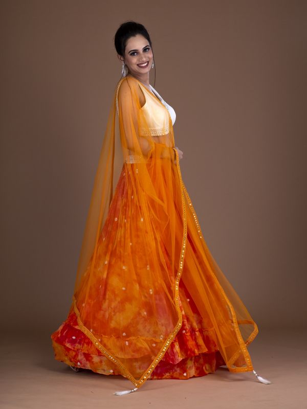Orange Georgette Readymade Lehenga In Tie Dye Color With Mirror Work And White Choli In Silk Fabric Mirror Work Border With Net Dupatta